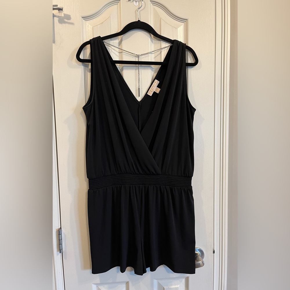 Michael Kors black short romper with chain detail at back. Size large.